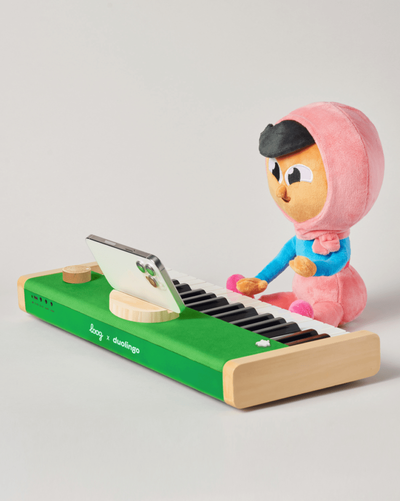 The Loog x Duolingo piano, image from Duolingo's store - the green limited-edition version supports playing along with Duolingo's music course